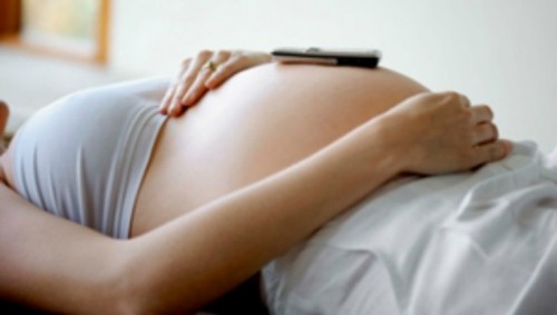 Pregnant woman with a cell phone / photo from http://www.mnn.com