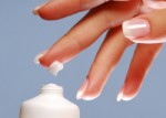 Moisturizer on the end of woman finger. /photo from http://www.sheknows.com