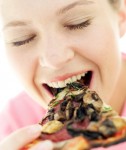 woman-eating-pizza / photo from http://www.realsimple.com